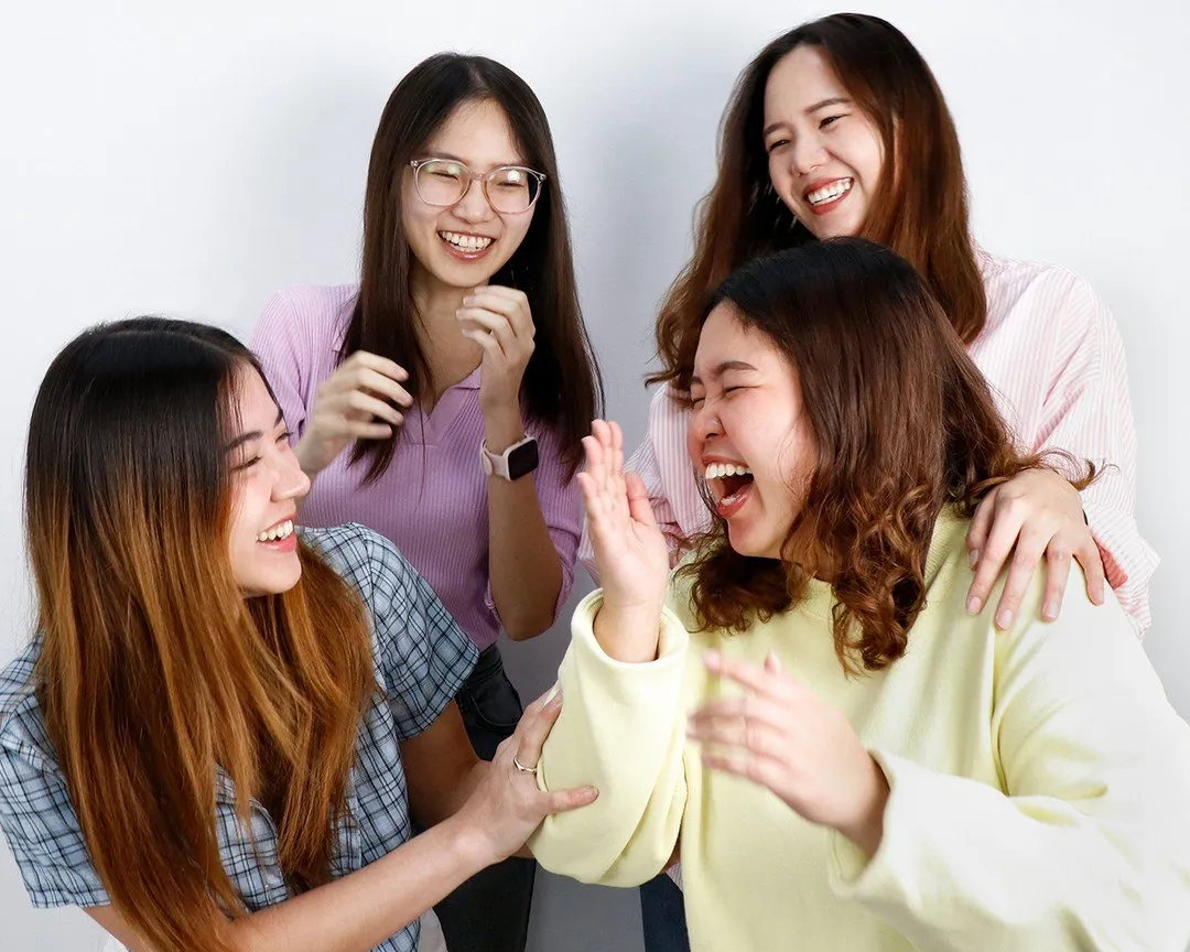 Four Primal colleagues laughing together
