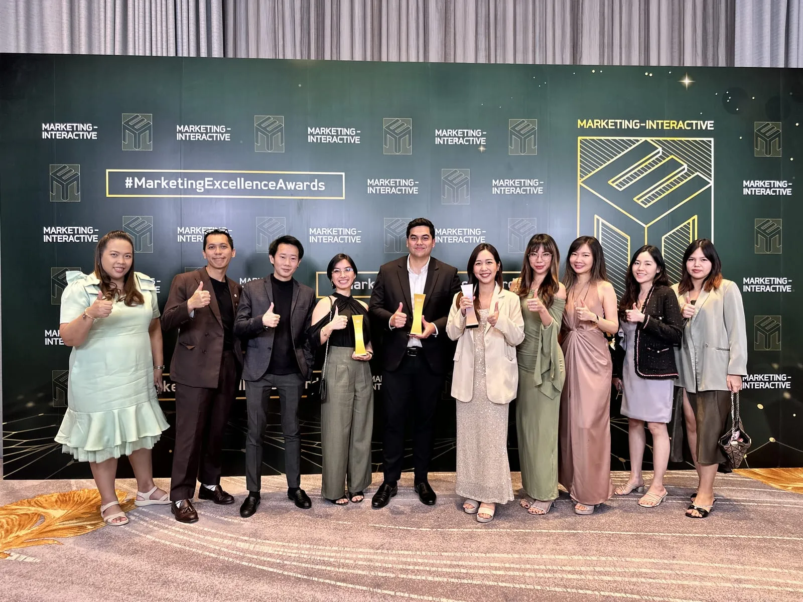 The Primal team with their trophies in front of the Marketing Excellence Awards 2024 backdrop