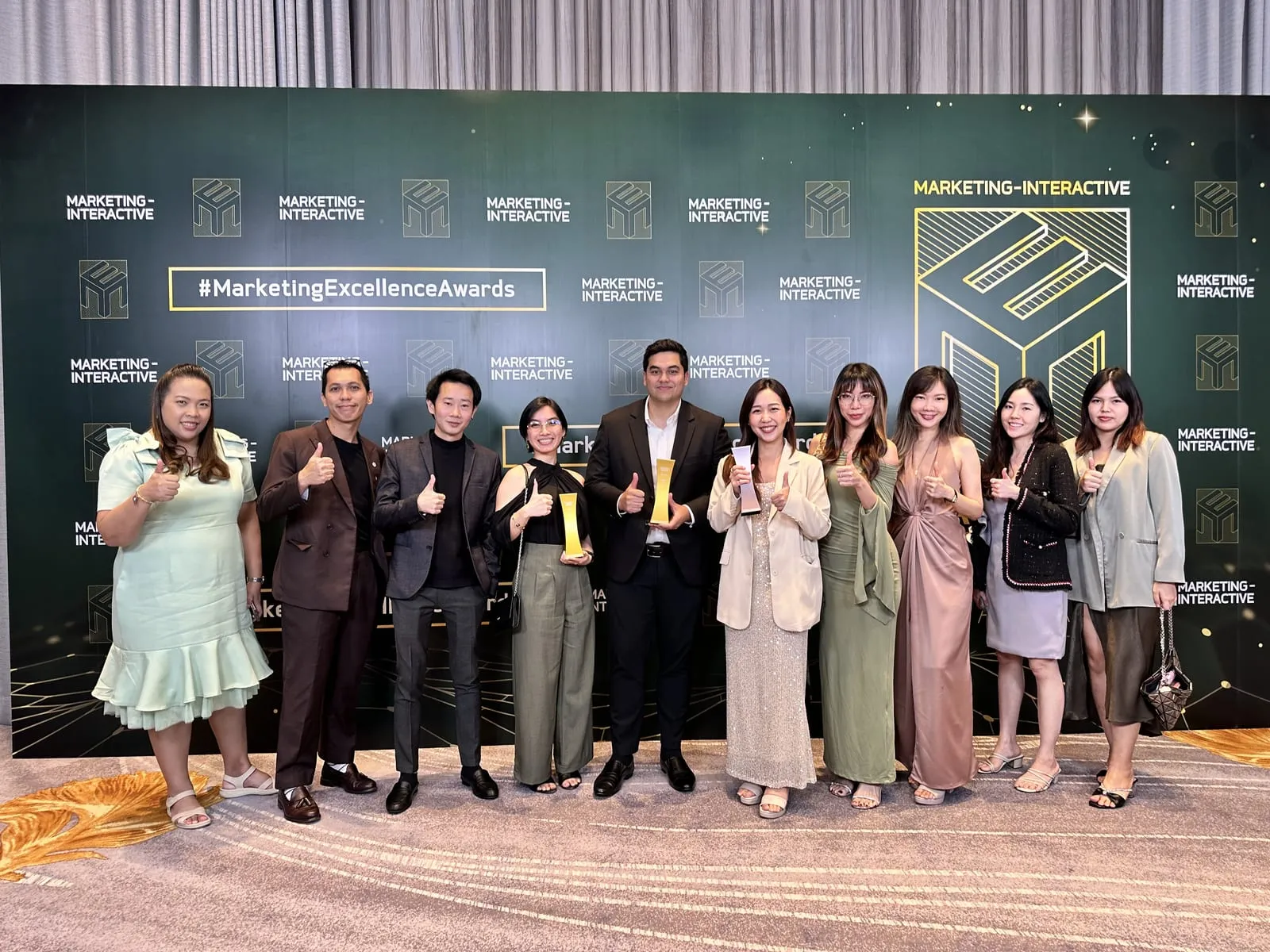 The Primal team with their trophies in front of the Marketing Excellence Awards 2024 backdrop