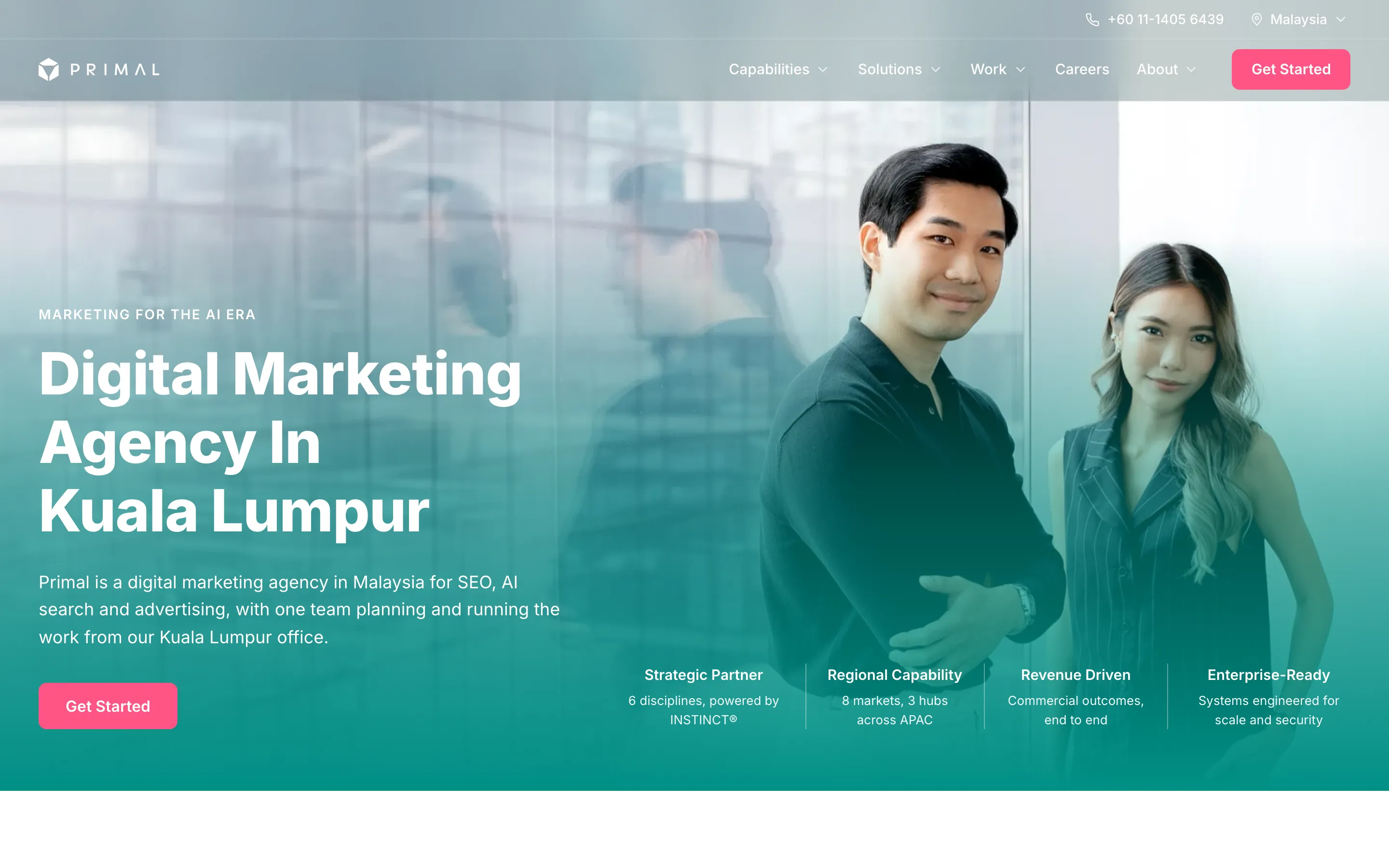 Primal’s home page, with a digital marketing agency headline over a teal-tinted photo of two people and a Get Started button