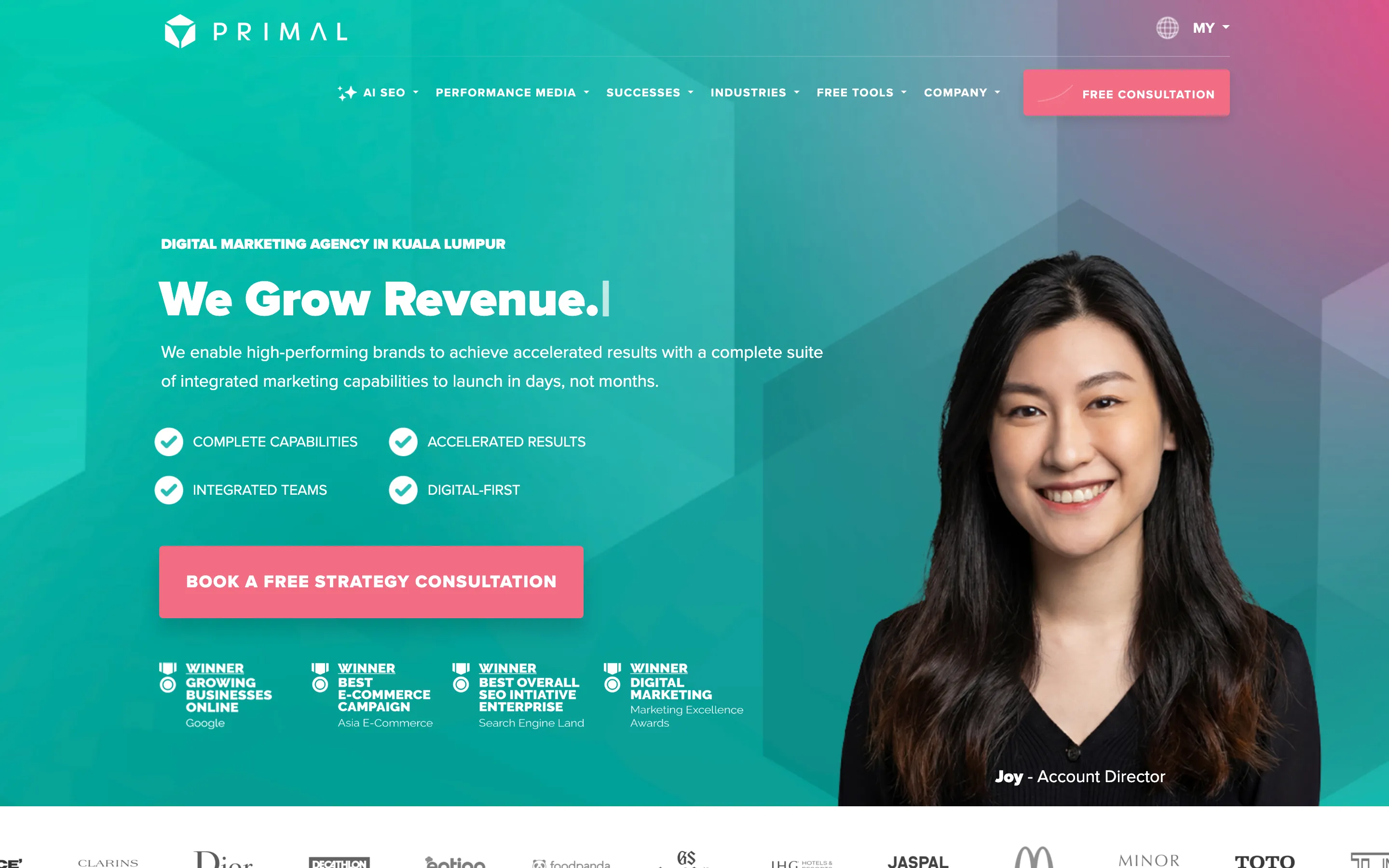 Primal’s home page, with AI SEO first in the menu, a headline about growing revenue, a consultation button and a photo of an account director