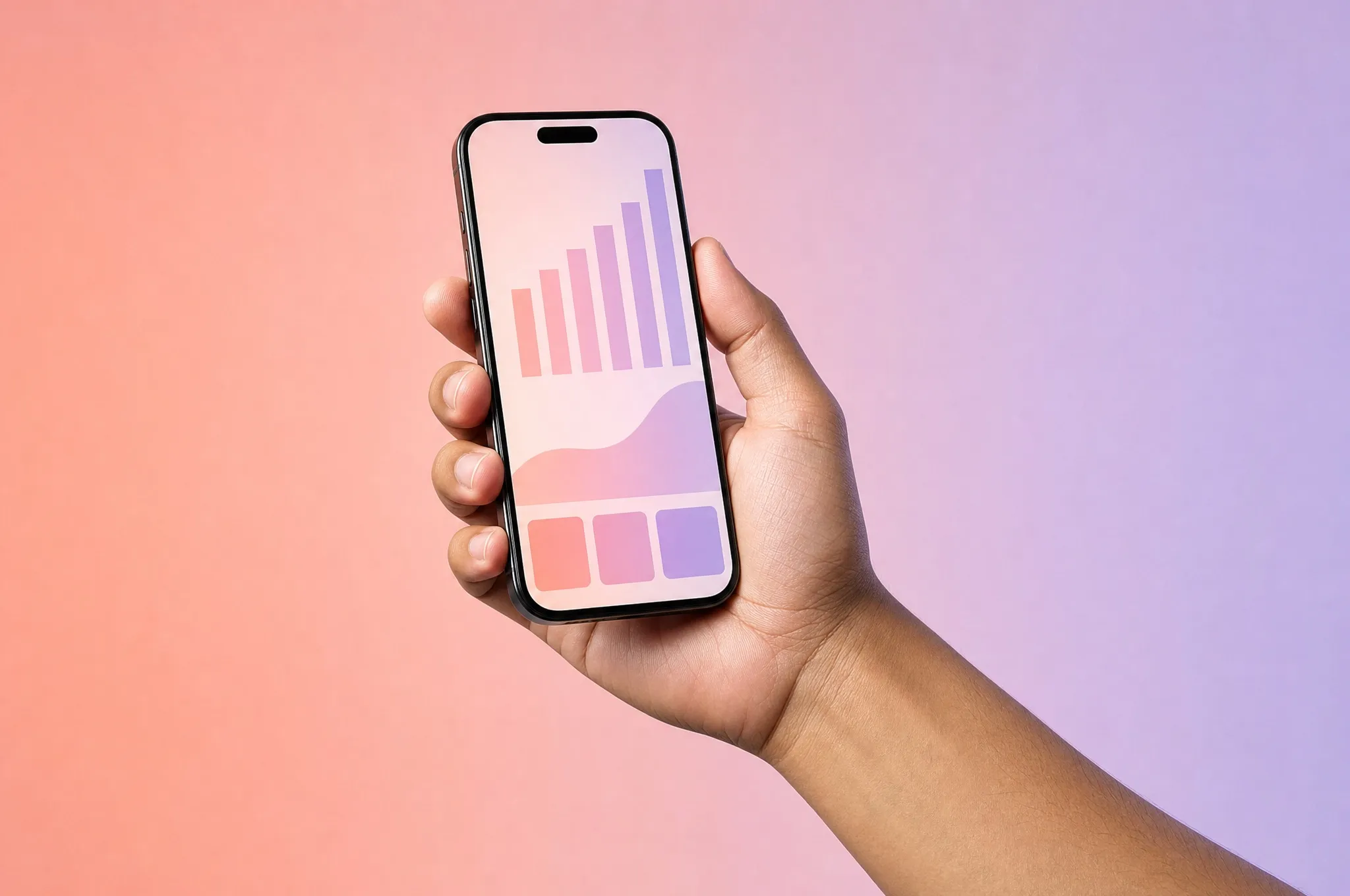 A hand holding a phone with a reach chart