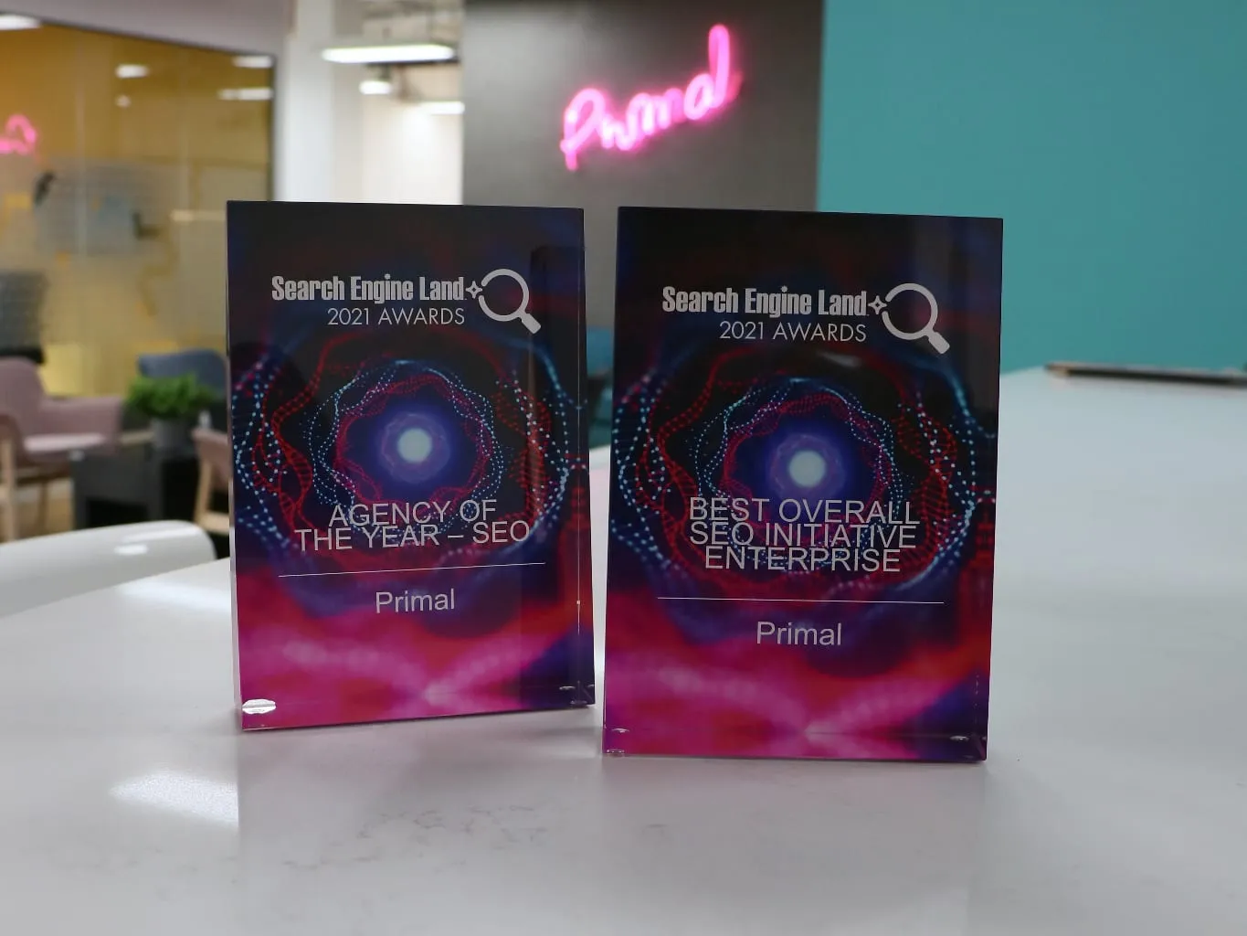 The two Search Engine Land Awards 2021 plaques on a table in the Primal office