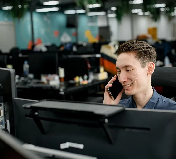 A Primal team member on a call at his desk