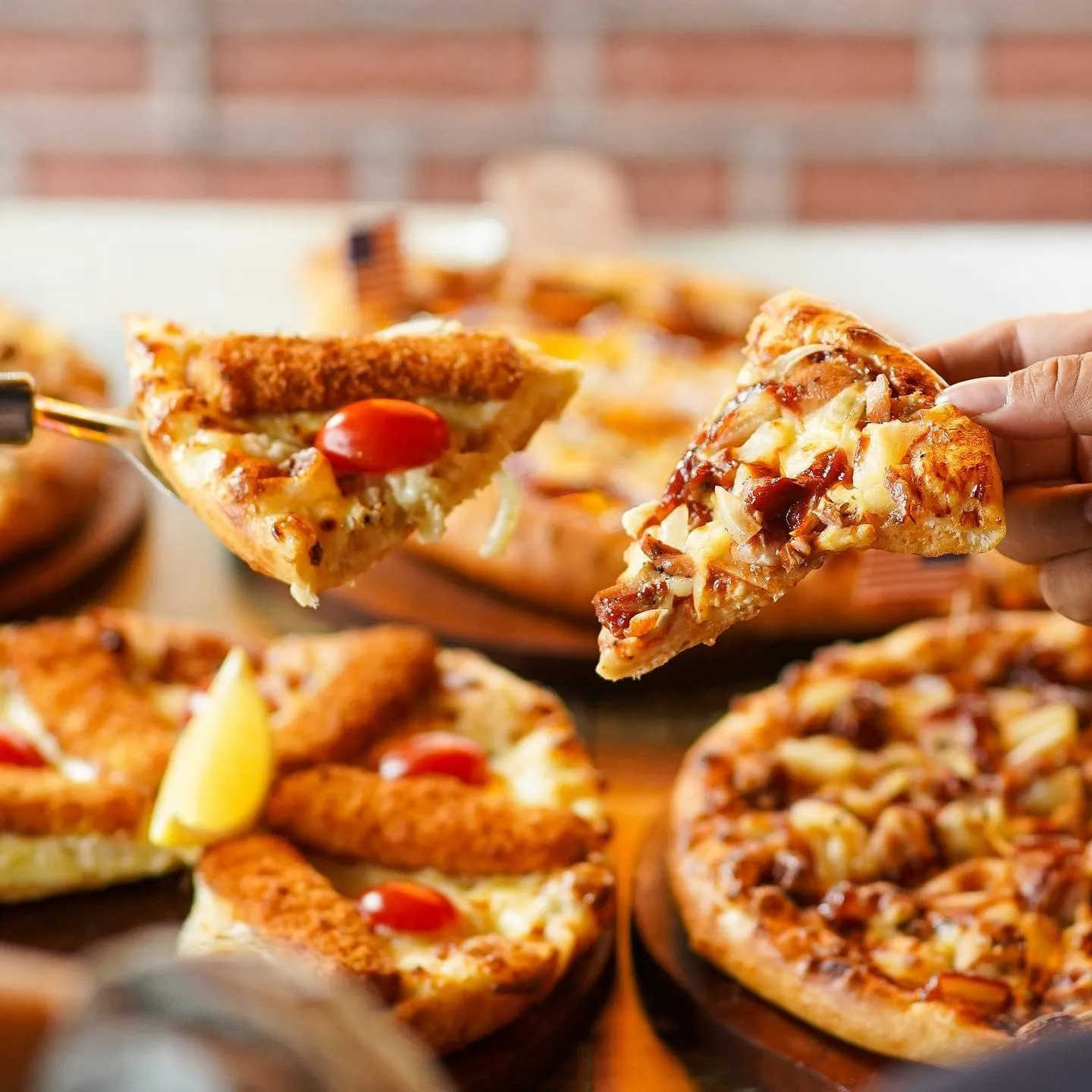A fresh pizza on a wooden board on a restaurant table