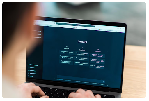 A person opens up ChatGPT on a laptop, prepared to type in ChatGPT prompts.