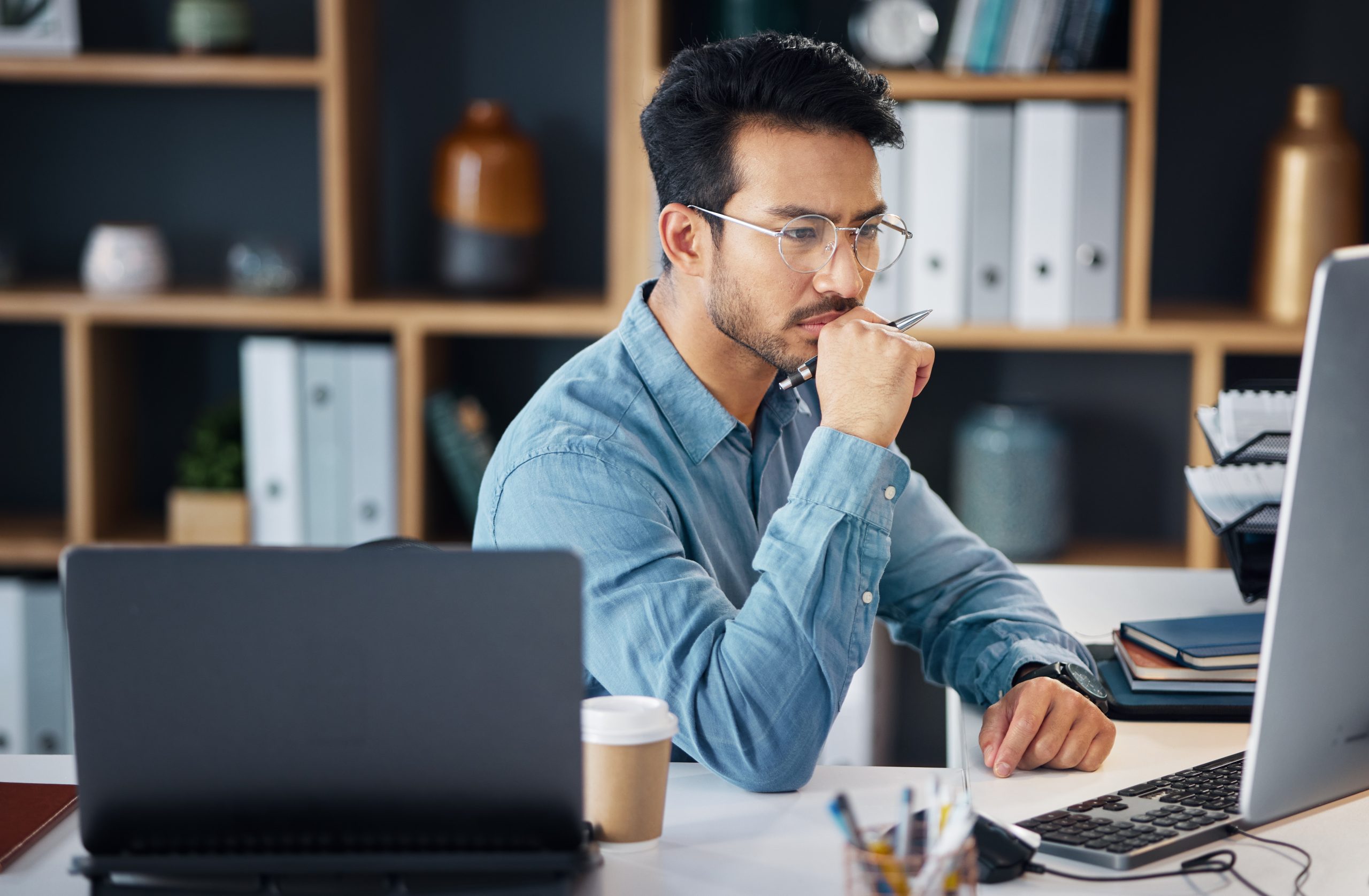 A digital marketer reviewing Google spam policies documentation on his computer.
