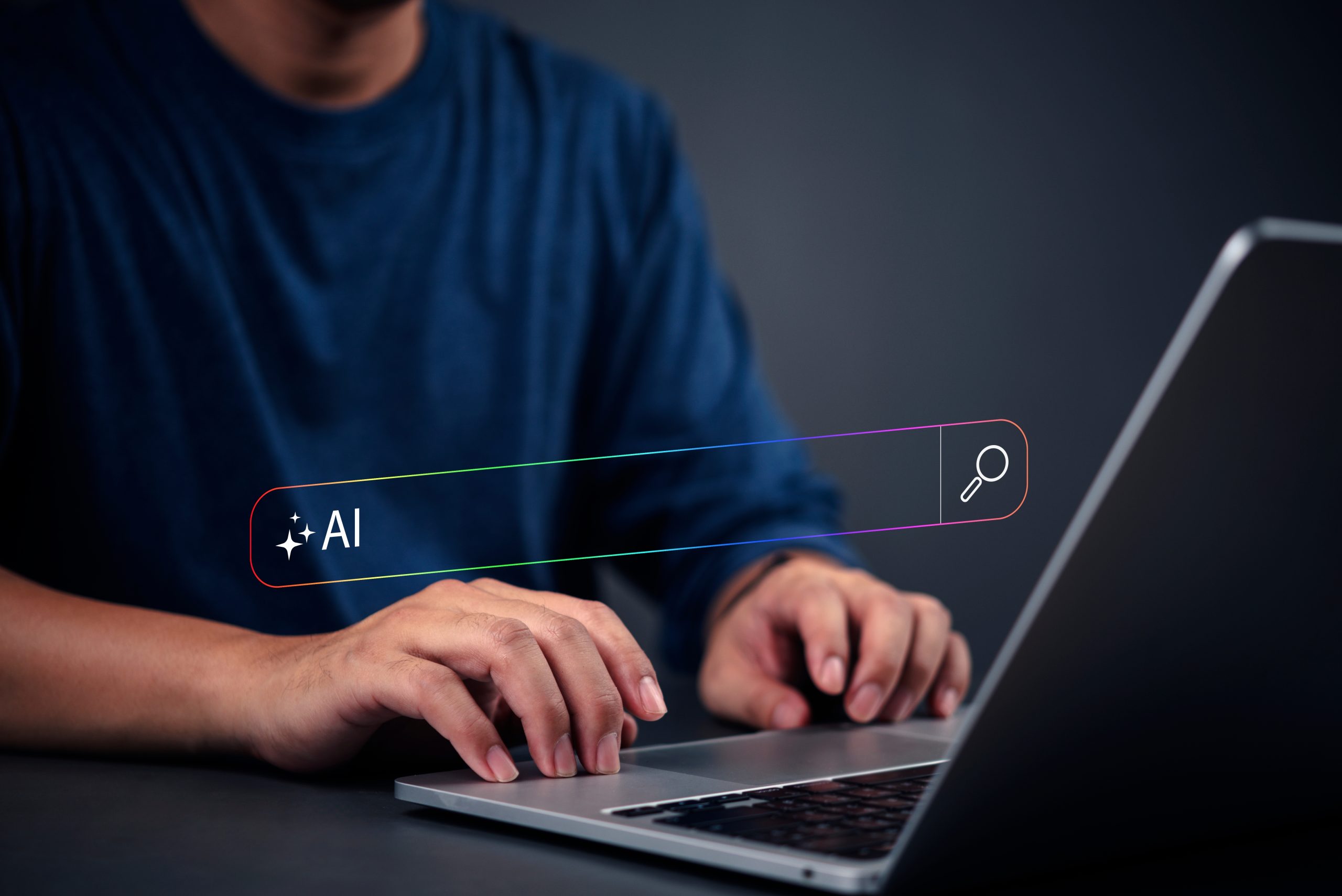 A person performing an AI search. Proper AI search optimization matters for getting traffic now.