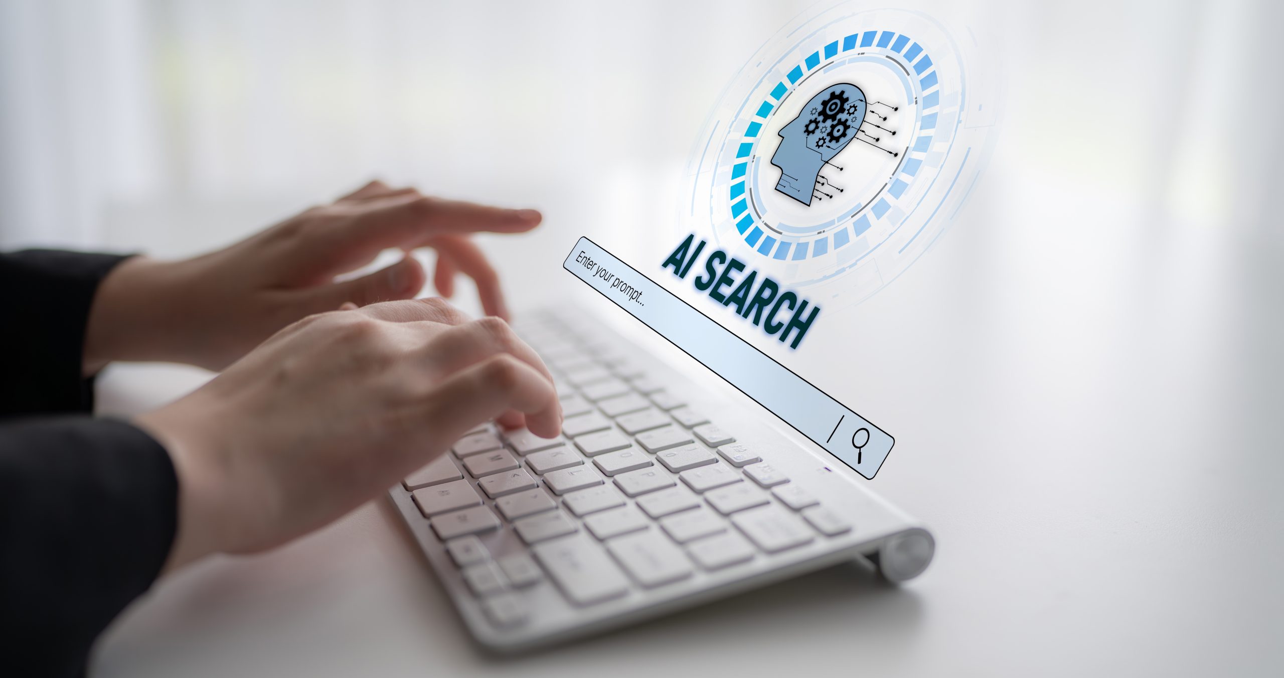 Fingers typing on a keyboard for AI search, one of the biggest key trends in digital marketing.
